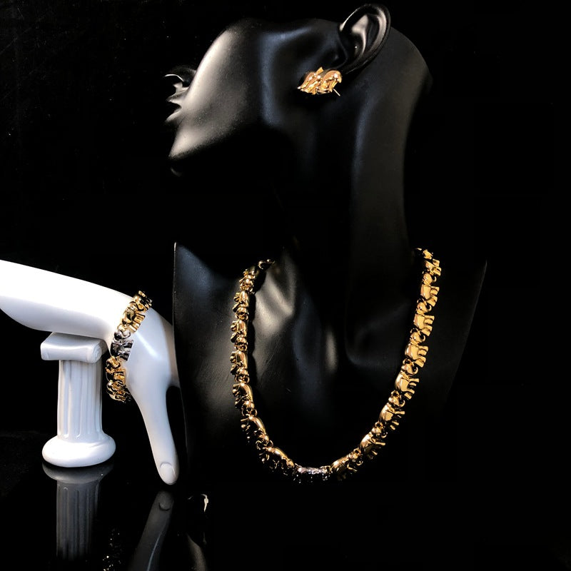 New stylish and versatile design, featuring a simple gold-tone aesthetic, and a fashionable elephant-themed necklace, bracelet, and earring set