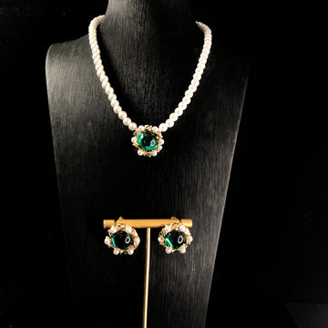 Vintage jewelry design, versatile pearl necklace with a green pendant, earrings, and a set of accessories – simple and stylish