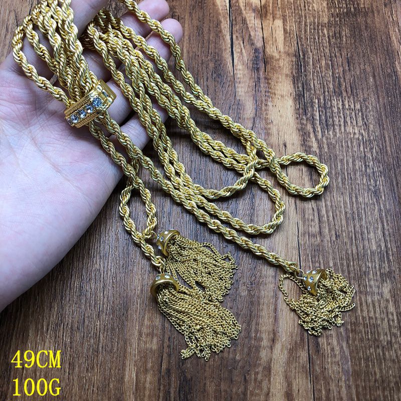Hong Kong-style, personalized, trendy, minimalist jewelry with diamond accents, featuring a geometric double-layer twisted chain design, a simple gold finish, and a fashionable tassel